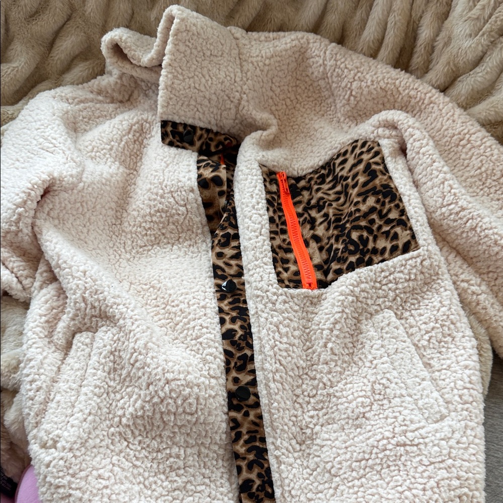 Amazon Cream Teddy Jacket with Leopard Print and Orange Accents